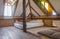 White and Brown Bed in Bedroom of Country Loft Interior Design Room