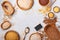 White, brown and red rice, buckwheat, millet, corn groats, quinoa and bulgur in wooden bowls on the light gray kitchen table. Glut