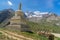 White Buddha stupa and snow mountain in Zanskar valley, Jammu Kashmir, India