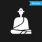 White Buddhist monk in robes sitting in meditation icon isolated on black background. Vector Illustration