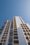 White building on blue sky , apartment building facade