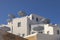 White building with stripy parasols