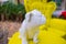 White bulldog statuette on vintage yellow table and armchair in park