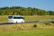 White bus on the road in the countryside