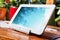 White Business Tablet On A Stand In Relaxing Atmosphere