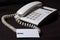 White business telephone on table.