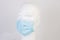 White bust with blue hygienic mask on white background