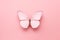 white butterfly on a pink background. is surrounded by beautiful petals, which create a vivid and contrast with its snow