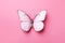 white butterfly on a pink background. is surrounded by beautiful petals, which create a vivid and contrast with its snow