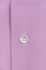 White button on a classic purple shirt. macro photo. Clothing for a businessman. cotton men`s shirt close-up