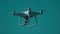 White camera quadcopter flying in front of blue clear sky