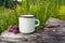 White campfire enamel mug mockup with red clover