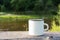 White campfire enamel mug mockup river view