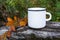 White campfire mug mockup with orange leaf