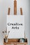 White canvas creative arts painted in black paint paintbrushes and artist eseal