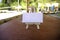 White canvas frame and wooden tripod under bamboo hut.