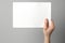 White canvas Hands grasp blank paper, highlighting creative possibilities in isolation