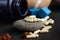 white capsules on stone with black background