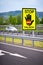 White car on the highway in the austrian countryside with the STOP/ FALSCH stop / false sign to warn the drivers