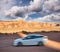 White car speeding up in Monument Valley National Park