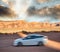 White car speeding up in Monument Valley National Park