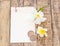 White Card and Plumeria flower on wooden