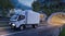 White Cargo Delivery Trucks in Motion