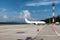 White Cargo Jet on Airport with clouds and blue sky in background