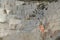 White Carrara marble quarry in Tuscany. Mountains of the Apuan Alps, blue sky and a mechanical excavator