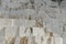 White Carrara marble quarry in Tuscany. Mountains of the Apuan Alps, blue sky and a mechanical excavator