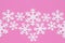 White carved snowflakes of foam plastic on pink background in creative style. Winter holiday. Christmas pattern with snow effect.