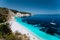 White catamaran yacht in clear blue sea water. Tourists on sandy beach near azure sea lagoon