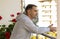 White Caucasian man stands on terrace, balcony of