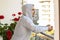 White Caucasian man stands on terrace, balcony of