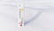 White celsius scale thermometer in the snow. Ambient temperature minus 19