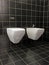 White ceramic bidet and toilet bowl