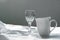 White ceramic coffee cup and wine glass on fabric for food and drink background