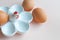 White ceramic egg holder with egg on soft background. Ceramic chicken