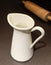 White Ceramic Milk Jug with Wooden Rolling Pin