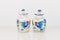 White ceramic pitchers with blue trim salt and pepper shakers