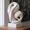 White Ceramic Sculpture On Wooden Base: A Mixed Media Art Piece