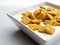 White ceramic square bowl with chocolate filled cereals