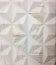 White Ceramic Tile in a Geometric Triangle Pattern