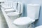 White ceramic toilet bowls. Plumbing trade