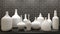 White ceramic vessels on the shelf, against the background of the kipichny wall. 3D rendering