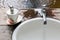 White ceramic washing sink and sope dispenser with vintage style