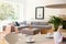 White chair at table in bright apartment interior with grey corn