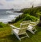 White Chairs Overlooking The Rugged Shore of Kaihalulu Bay