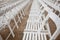 White chairs on the roof. Concert hall. Many white wooden chairs