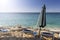 White chairs, umbrella and stone pyramids